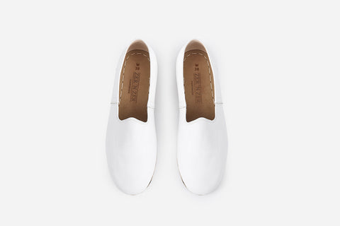 Elegant Arctic white leather loafers for women, handmade with precision for a polished and refined appearance.