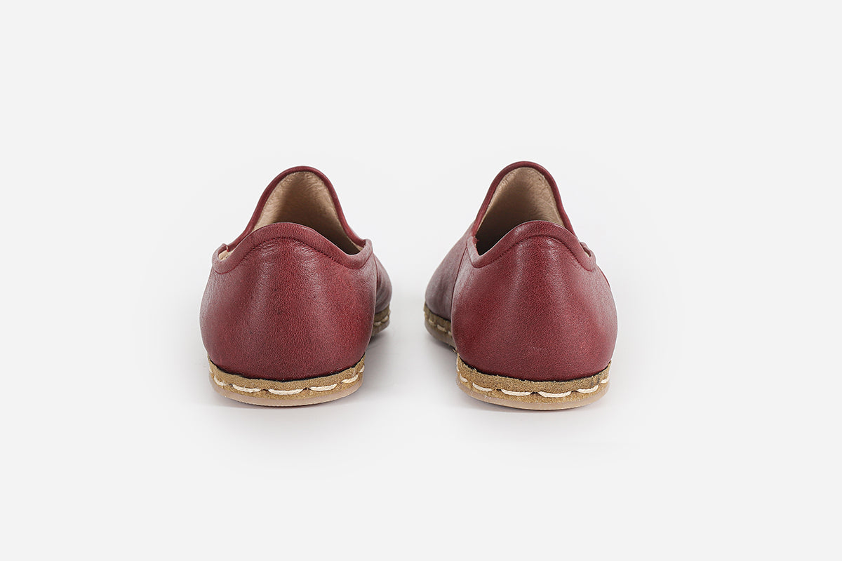 Stylish handmade burgundy loafers for women, made from premium leather with a refined, elegant appearance.