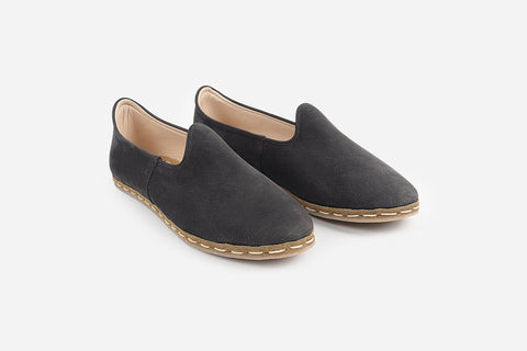 Elegant handmade nubuck loafers in Eclipse Noir for women, featuring a luxurious black hue and detailed craftsmanship.