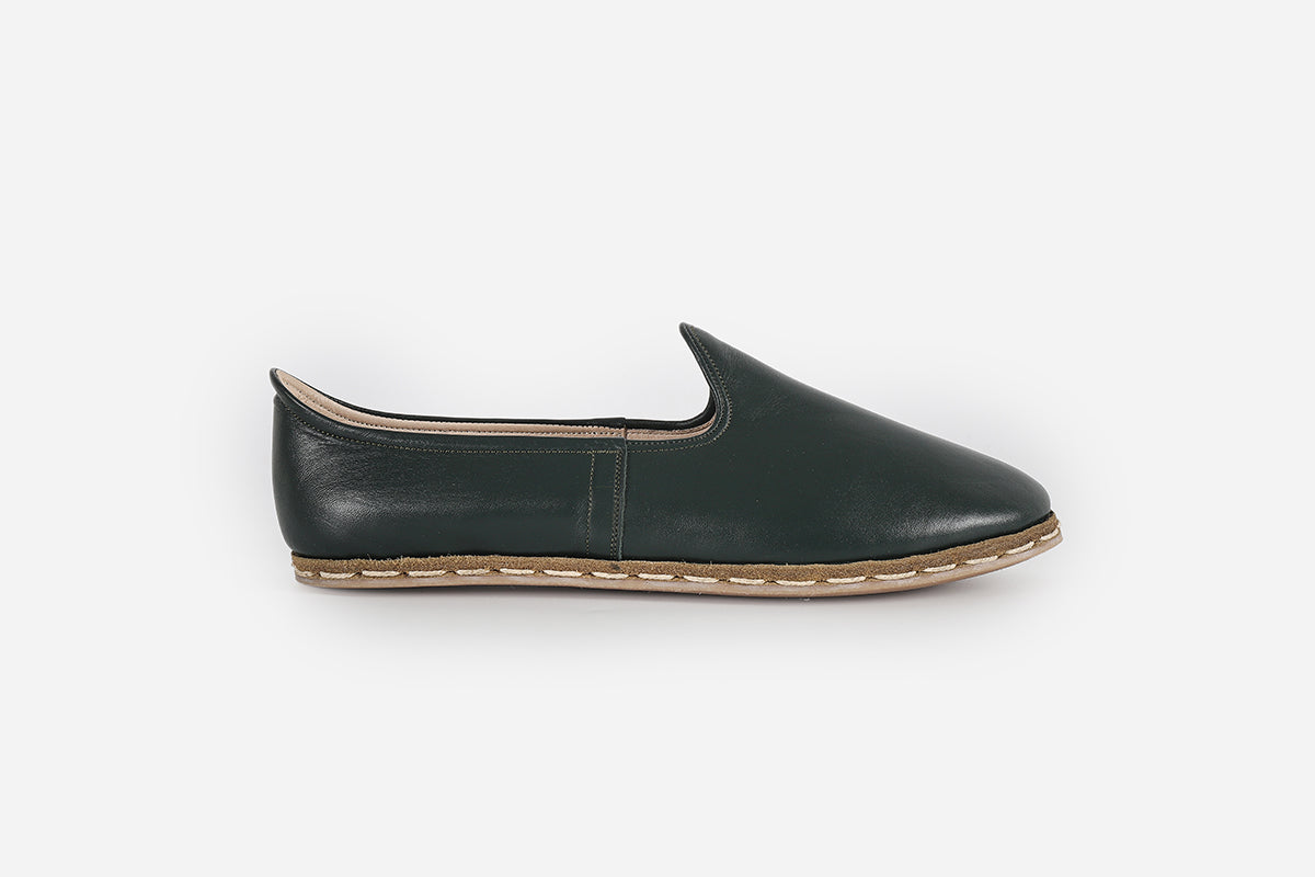 Women's evergreen leather loafers, handmade for a rich green hue and stylish, high-quality finish.