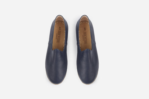 Stylish women's loafers in handmade midnight blue leather, offering a sleek, polished appearance.