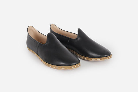 Elegant handmade leather loafers in Midnight Noir for women, featuring a luxurious black hue and refined craftsmanship.