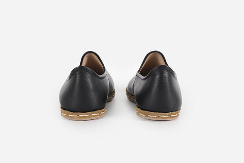 Stylish women's loafers in Midnight Noir leather, showcasing expert handcrafting and a rich, elegant color.