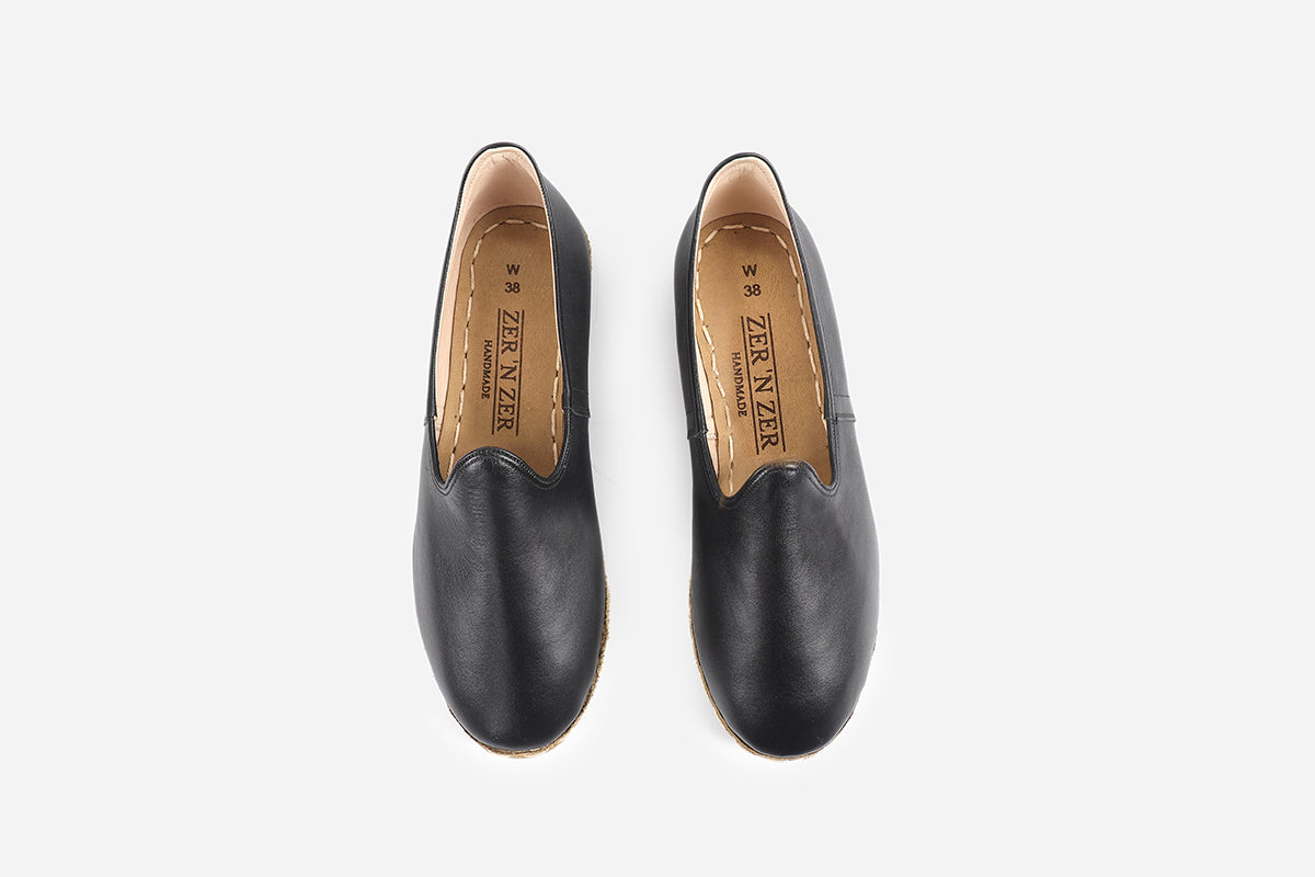 Chic Midnight Noir loafers for women, made from handmade leather with a polished, dark appearance.