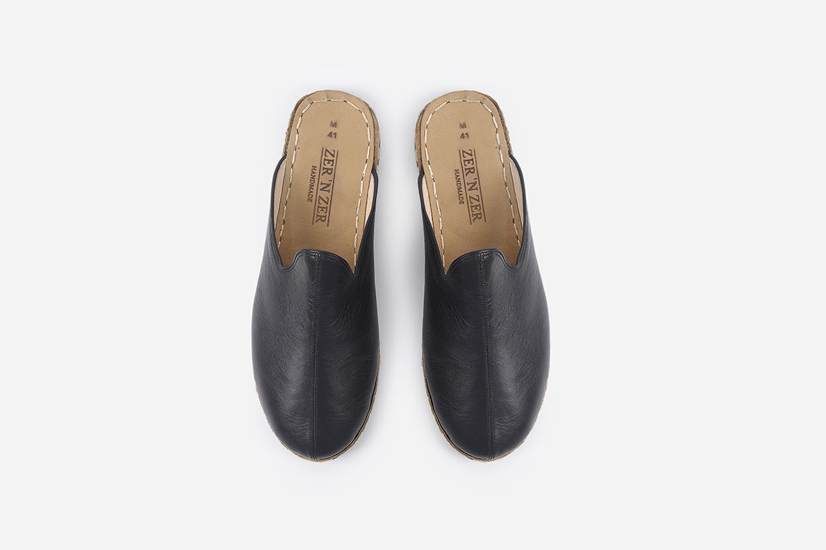 Stylish men's Midnight Noir leather slippers, offering a deep black hue and expert handcrafting from Turkey.