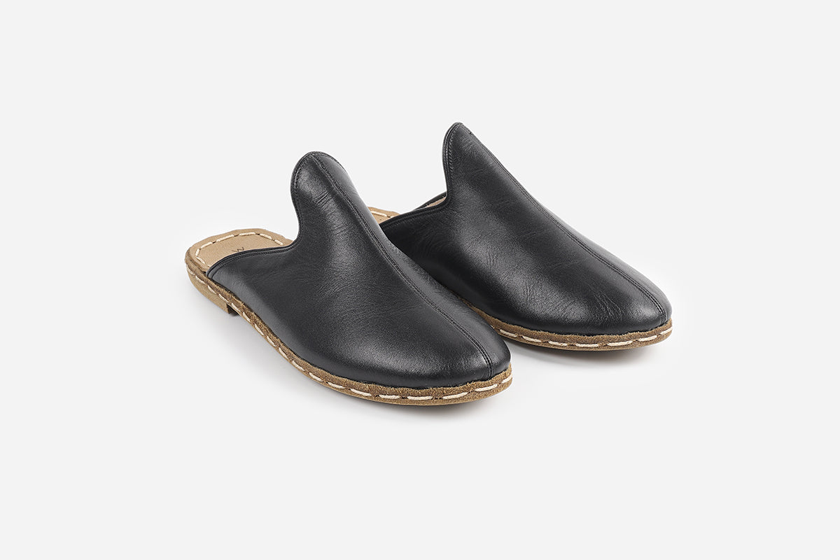 Elegant handmade leather slippers in Midnight Noir for women, featuring a sleek, sophisticated black finish.