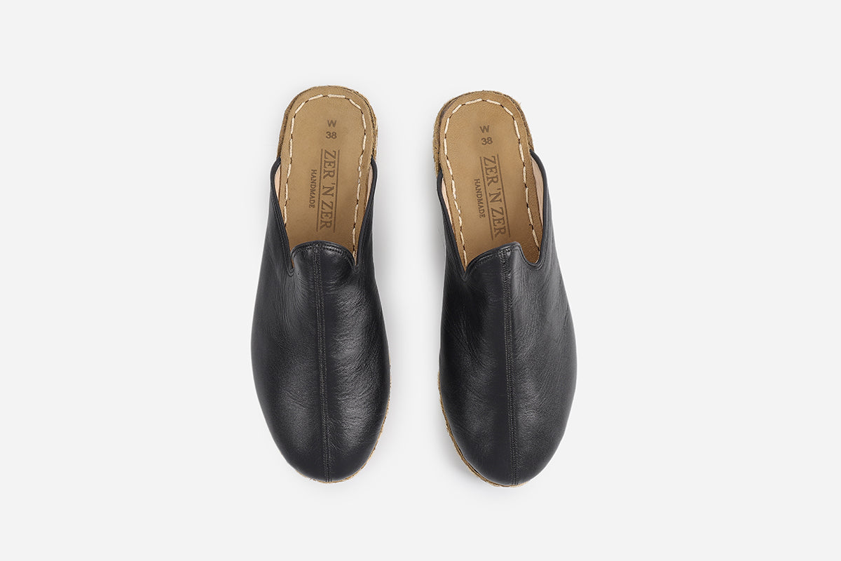 Chic Midnight Noir slippers for women, made from handmade leather with a polished and dark appearance.