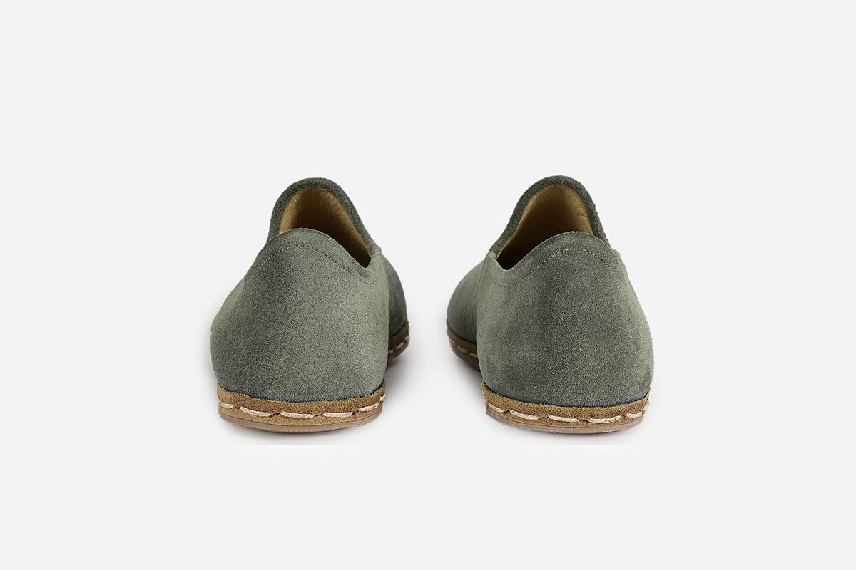 Stylish women's loafers in Sage Green suede, showcasing expert handcrafting and a sophisticated, muted green tone.