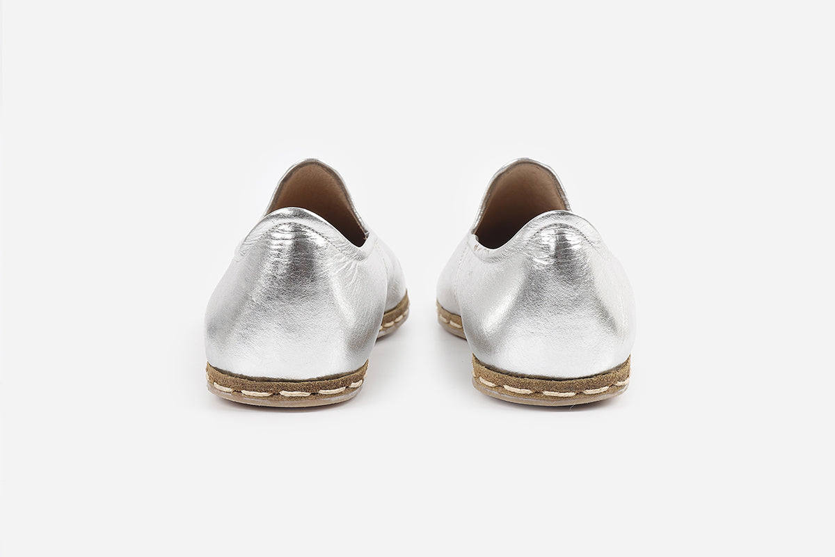 Stylish women's loafers in Silver Frost leather, showcasing expert handcrafting and a refined, frosty silver color.