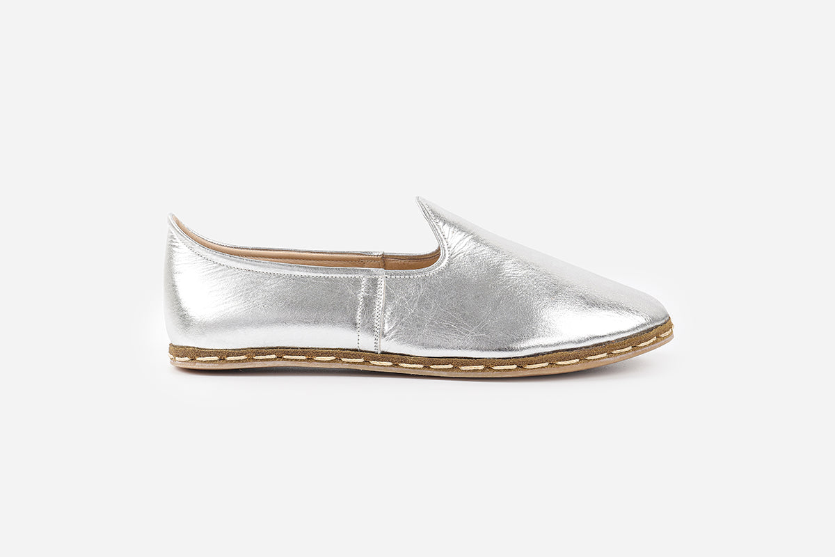 Women's loafers in Silver Frost leather, handmade for a sleek, metallic finish and elegant design.