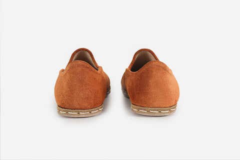 Stylish women's loafers in Sunset Orange suede, offering a unique, handmade look with a radiant, sunset-inspired color.