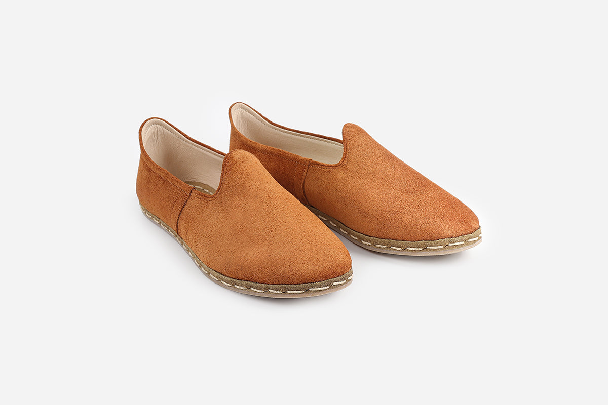 Elegant handmade suede loafers in Sunset Orange for women, featuring a bright, eye-catching hue and meticulous craftsmanship.